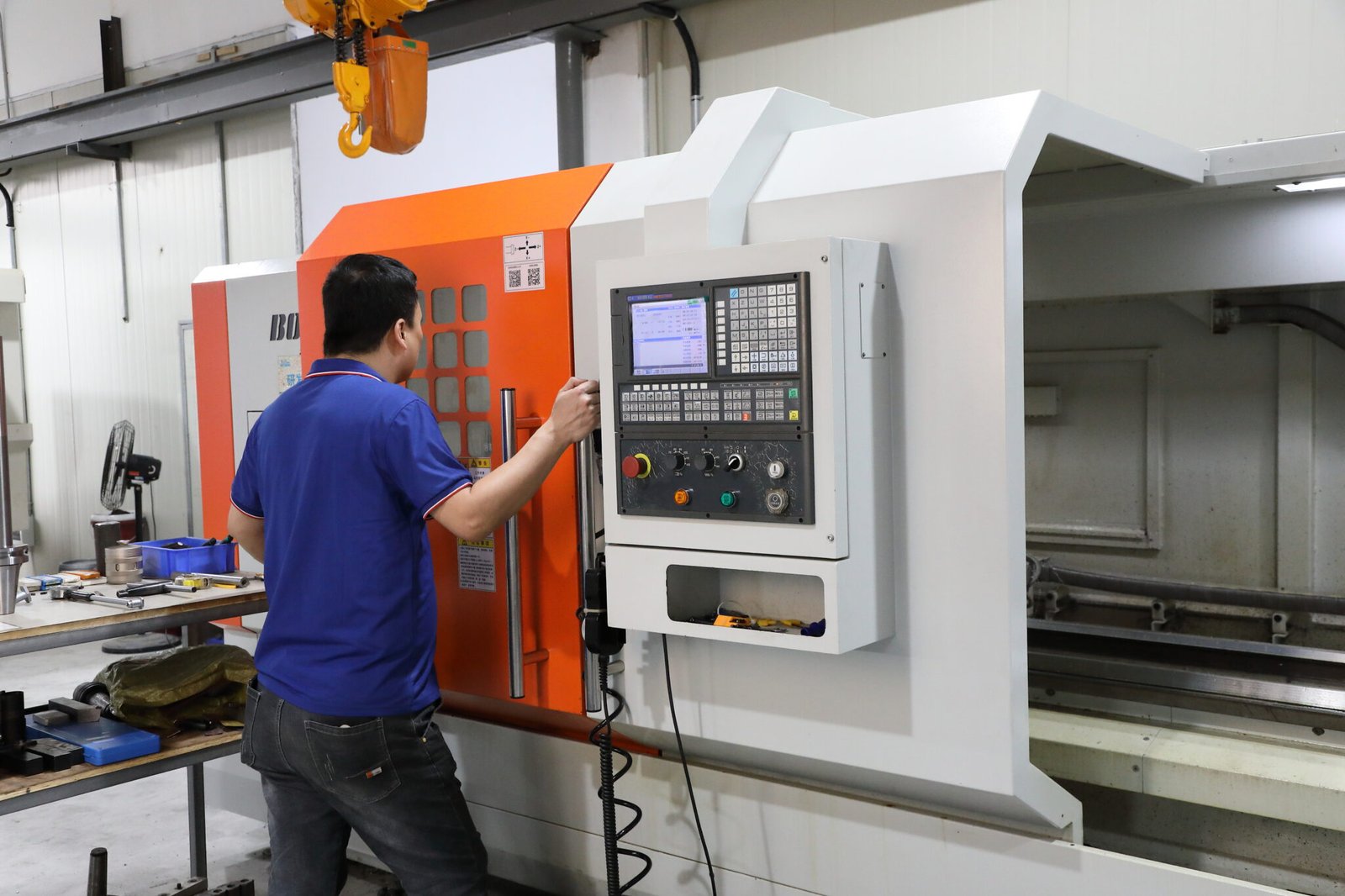 Operator setting controls on a CNC machining center